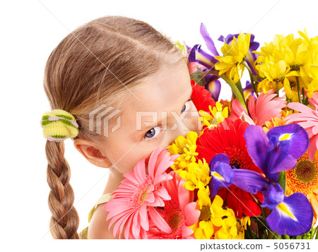 Happy child holding flowers. 5056731