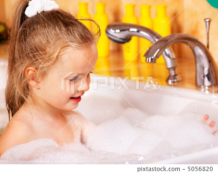 Kid washing in bath. 5056820