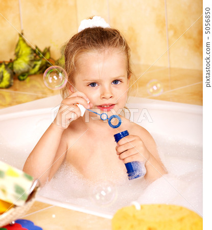 Kid washing in bath. 5056850
