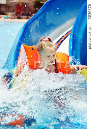 Child on water slide at aquapark. 5056876
