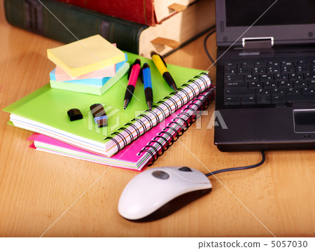 Books and laptop. School supplies. 5057030