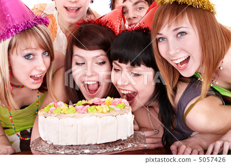 Group of happy young people with cake. 5057426