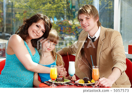 Happy family with child in restaurant. 5057573
