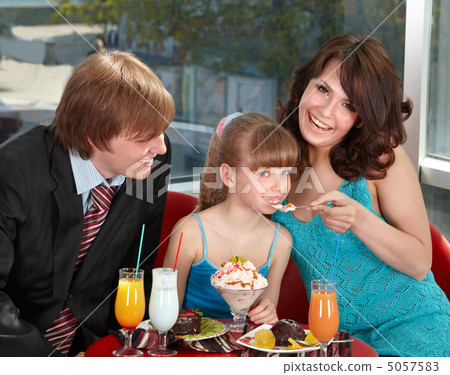 Happy family with child in cafe. 5057583