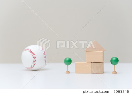 A house made of building blocks and a baseball A house made of building blocks and a baseball 5065246