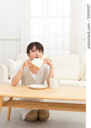 A woman eating bread A woman eating bread 5069507