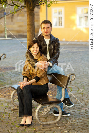 love couple sitting on a bench love couple sitting on a bench 5073287