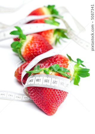 big juicy red ripe strawberries and measure tape isolated on whi 5087341