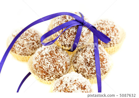 cake with coconut tied with ribbon isolated on white 5087632