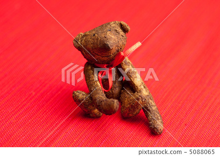 Teddy bear handmade on a red background Teddy bear handmade on a red background 5088065
