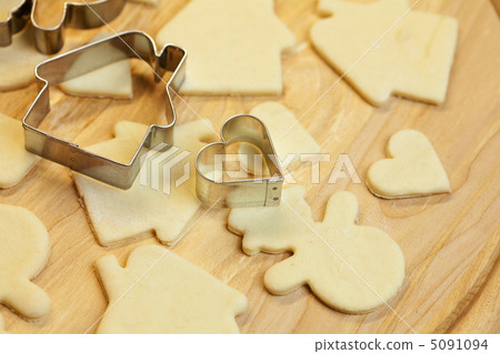 cut dough snowman, house, heart, and forms for cookies cut dough snowman, house, heart, and forms for cookies 5091094