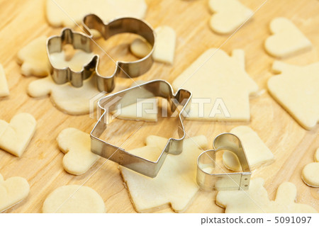 cut dough snowman, house, heart, and forms for cookies cut dough snowman, house, heart, and forms for cookies 5091097