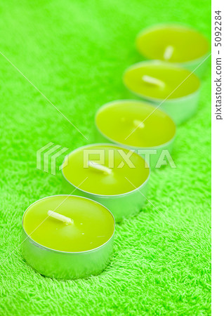 a few candles lying on the towel a few candles lying on the towel 5092284