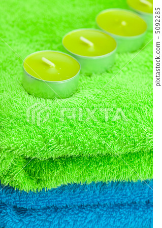 a few candles lying on the towel a few candles lying on the towel 5092285
