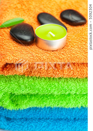 background of the three multi-colored bath towels, black spa sto background of the three multi-colored bath towels, black spa sto 5092304