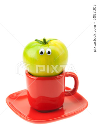 tomato with eyes in the cup isolated on white tomato with eyes in the cup isolated on white 5092305