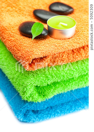 background of the three multi-colored bath towels, black spa sto background of the three multi-colored bath towels, black spa sto 5092309