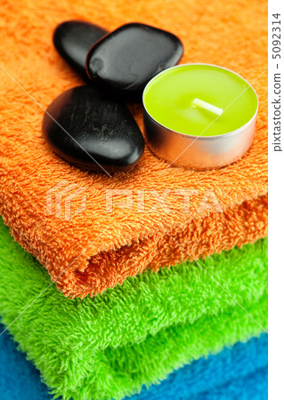background of the three multi colored bath towels, spa black sto background of the three multi colored bath towels, spa black sto 5092314