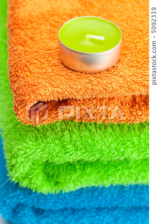background of the three multi colored terry towels and candle background of the three multi colored terry towels and candle 5092319