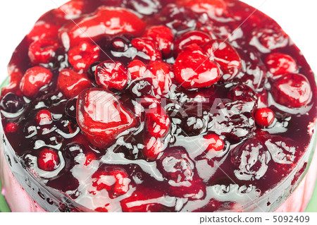 beautiful cake with berries on a plate isolated on white beautiful cake with berries on a plate isolated on white 5092409