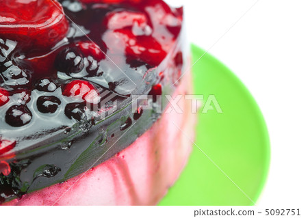 beautiful cake with berries on a plate isolated on white beautiful cake with berries on a plate isolated on white 5092751