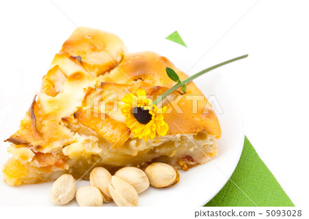 piece of apple pie and a flower lying on the green cloth piece of apple pie and a flower lying on the green cloth 5093028