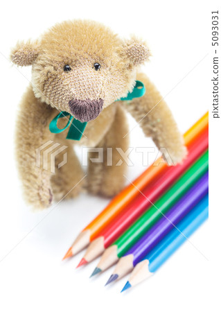 Teddy Bear and colored pencils isolated on white Teddy Bear and colored pencils isolated on white 5093031