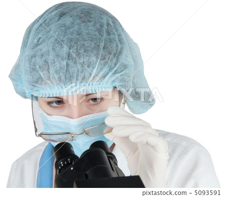 Female student using a microscope 5093591