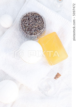 cosmetic containers, bottles, soap and lavender on a white towel 5097472