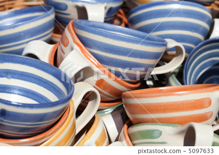 ceramic cups in a basket at the fair ceramic cups in a basket at the fair 5097633