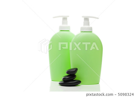 cosmetic containers and spa black stones isolated on white cosmetic containers and spa black stones isolated on white 5098324
