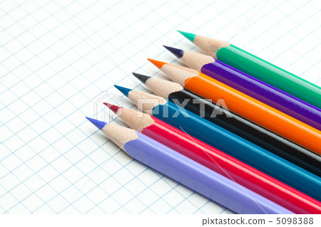 plaid notebook with a spiral  and colored  pencil 5098388