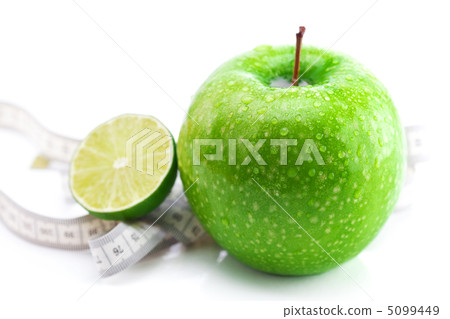 apple,lime and measure tape isolated on white 5099449