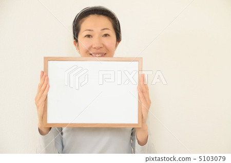 A woman with a white board 5103079