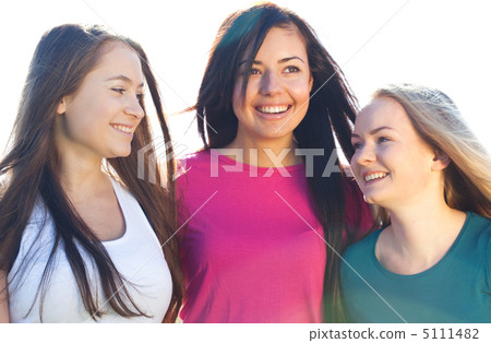 portret of three young beautiful woman on the  sky background 5111482