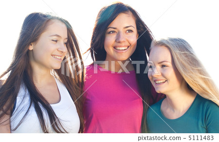 portret of three young beautiful woman on the  sky background 5111483