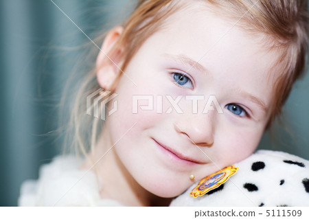 portrait of a beautiful little girl with a toy dog 5111509