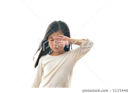 Elementary school student rubbing eyes 5115448