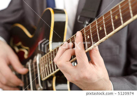 Businessman playing the guitar on white Businessman playing the guitar on white 5120974