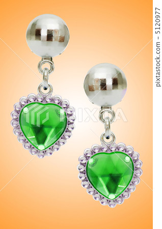 Silver earrings isolated on the white background Silver earrings isolated on the white background 5120977