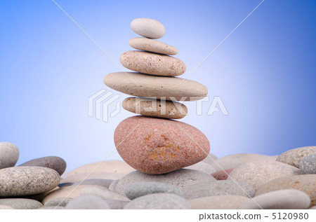 Pebbles stack against gradient background Pebbles stack against gradient background 5120980
