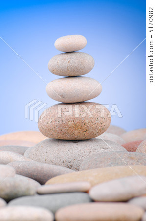 Pebbles stack against gradient background Pebbles stack against gradient background 5120982