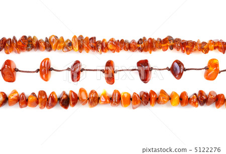 Beads of amber laid in a row Beads of amber laid in a row 5122276