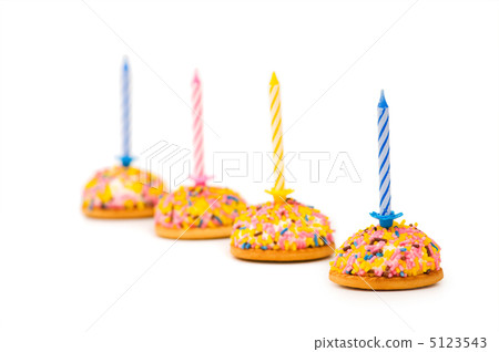 Cup cakes and candle isolated on the white background Cup cakes and candle isolated on the white background 5123543