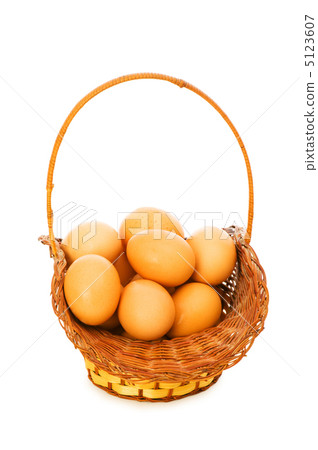 Basket full of eggs isolated on white Basket full of eggs isolated on white 5123607