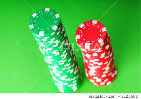 Stack of casino chips against green background 5123608