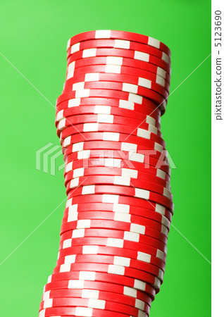 Stack of red casino chips against green background Stack of red casino chips against green background 5123690