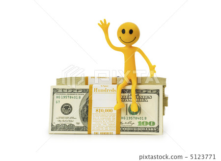 Smilie sitting on top of dollar stack Smilie sitting on top of dollar stack 5123771