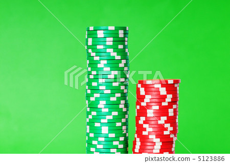 Stack of casino chips against green background Stack of casino chips against green background 5123886