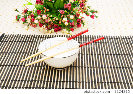 Chopsticks and bowl on the bamboo mat Chopsticks and bowl on the bamboo mat 5124215